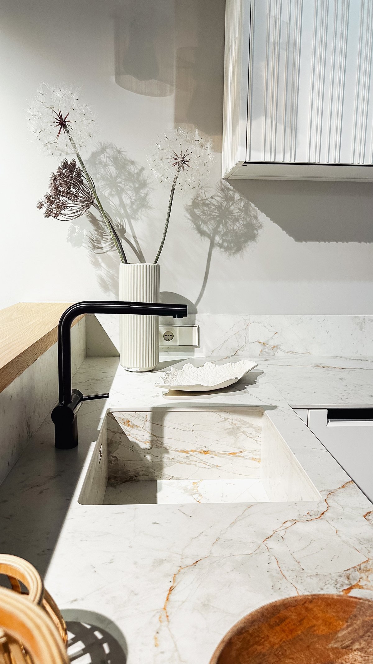 Contemporary kitchen with white marble countertop and island